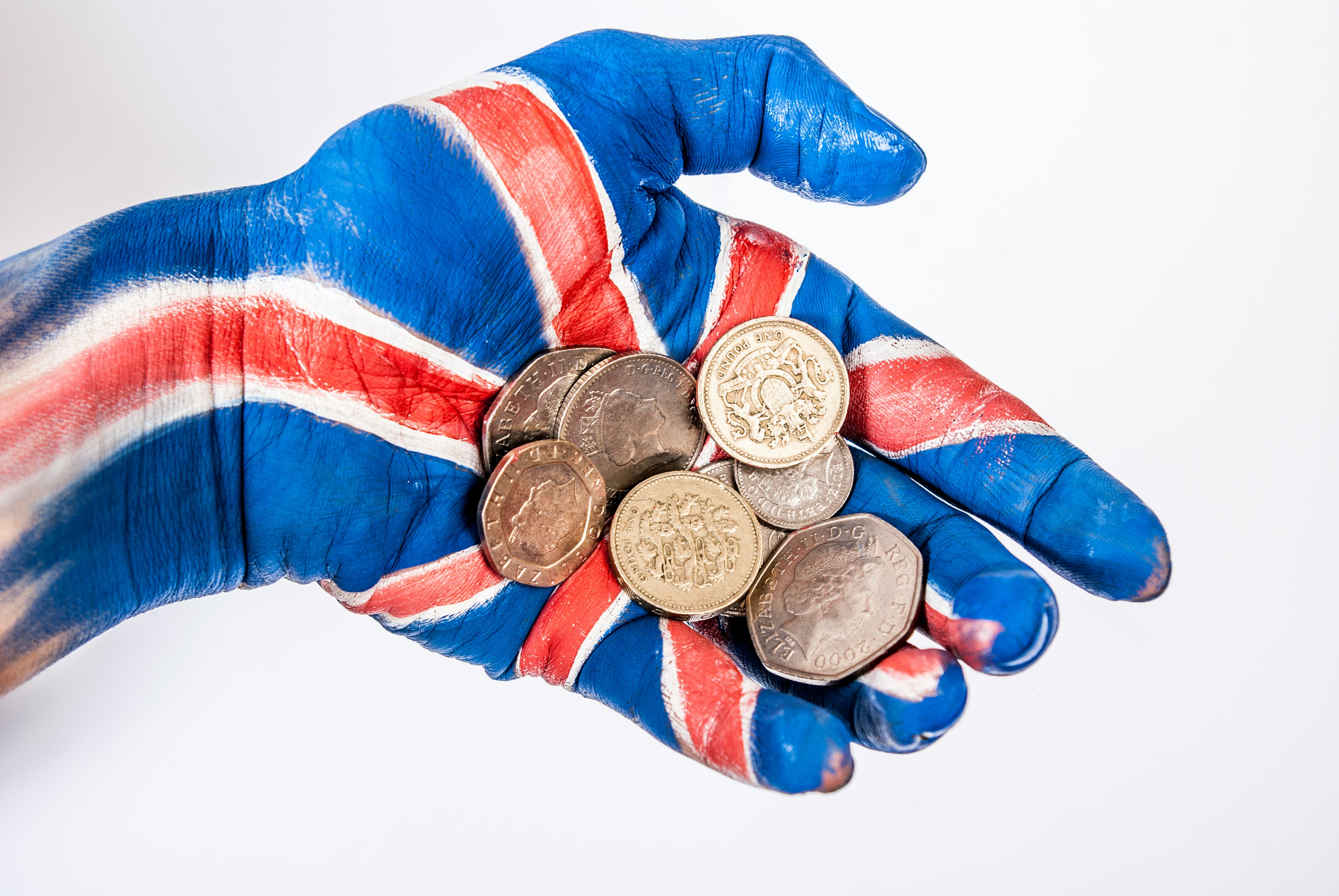 person in blue red and white long sleeve shirt wearing silver round coins